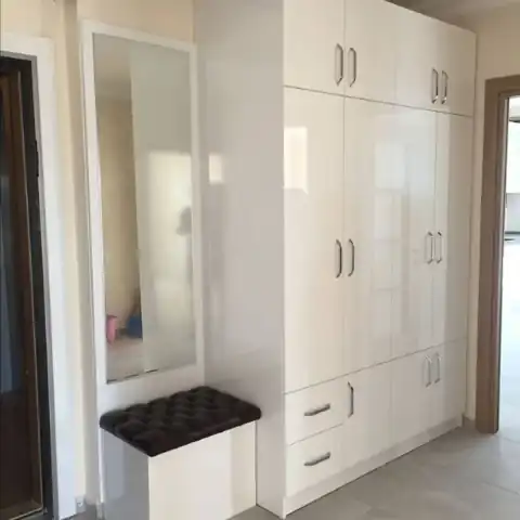 Floor-to-ceiling white built-in wardrobes with timber frame, Bryanston Sandton — Wito Projects