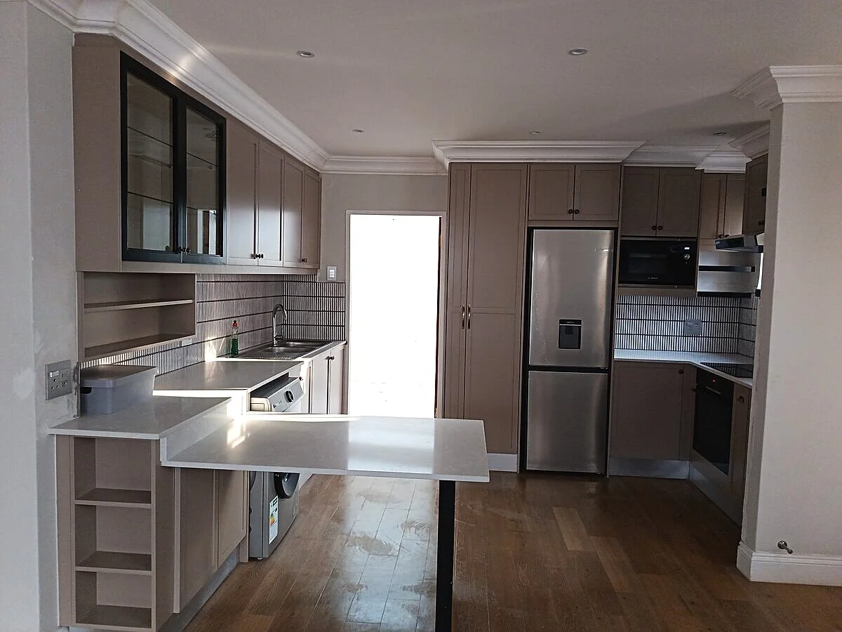 Morningside home renovation: full kitchen view with island and cabinetry, Sandton