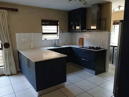 Handleless island and prep zone, petrol blue kitchen Fourways