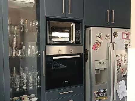 Open-plan view from living area toward Fourways kitchen installation