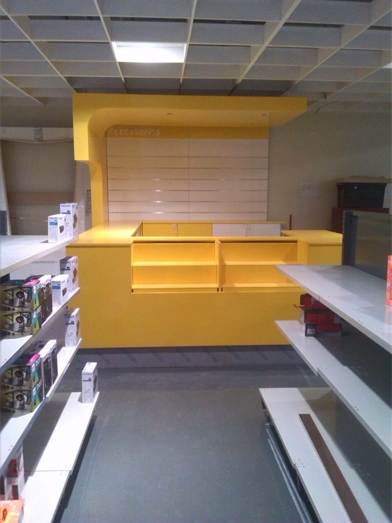 Yellow pop-up retail display counter with open shelving and product bays &mdash; Wito Projects Johannesburg