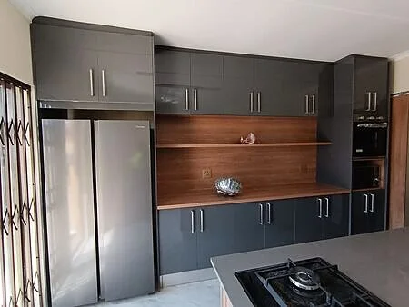 Roodepoort two-tone kitchen renovation — wood and gloss cabinetry, West Rand